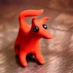 Polymer clay (featuring a small, brightly coloured dog)